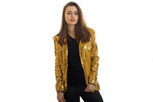 portrait of stylish pretty woman in golden jacket photo