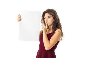 girl in red dress with white placard photo