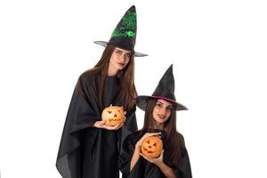 lovely young women with pumpkins in hands photo