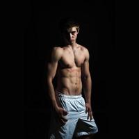 beauty muscle body sports man in studio photo