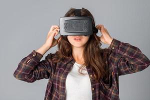 woman testing a virtual reality helmet photo