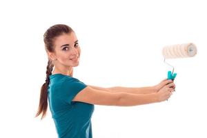 lovely brunette lady makes refurbish an apartment isolated on white background in studio photo