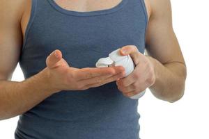 man causes shaving foam on hand close-up photo