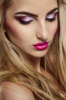 Pretty blonde woman with closed eyes photo