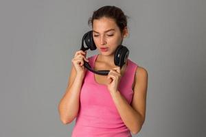 girl with headphones in studio photo