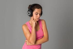 girl with headphones in studio photo