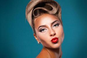 One adult woman with air kiss in studio photo