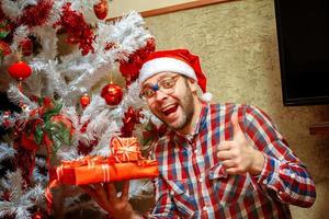 cheerful nerd gets Christmas presents photo