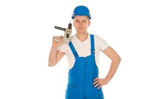 constructor masculino con taladro en las manos foto