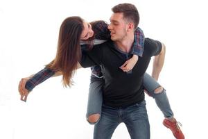 portrait of cheerful couple hugging and looking on each others photo