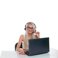 The girl in headphones with laptop photo