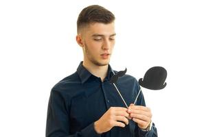 young guy holds paper props for photo close-up