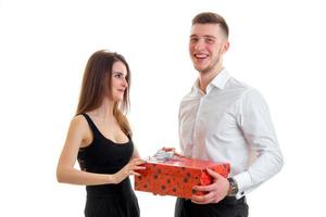 beautiful smiling guy brought a cute girl large gift photo