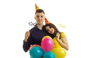 cute young guy and girl are in the Studio with colored balls photo