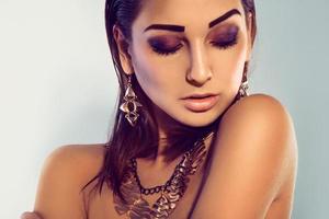 Horizontal portrait of fashion model with make up and accessories photo