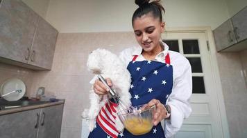 Baking in the kitchen with a dog