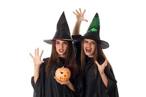 young women with pumpkins in hands photo