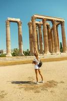 girl tourist in the ancient Greek temple of Zeus photo