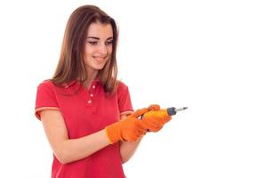 happy brunette lady builder makes renovation isolated on white background photo