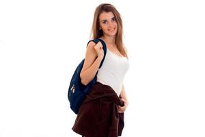 beautiful girl in a white t-shirt and a portfolio on the shoulder stands up straight and looking at camera isolated on white background photo