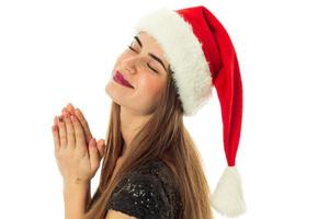 portrait of happy beautiful woman in santa hat photo