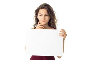 girl in red dress with white placard photo