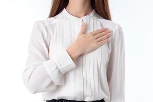 girl in shirt keeps his hand on the chest close-up photo