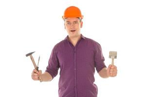 Builder with tools in his hands photo