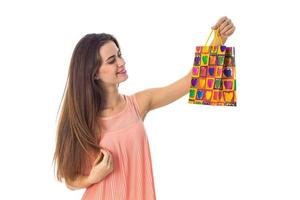 girl with long hair raised before an color package isolated on white background photo