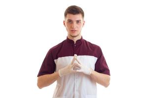 a young Laboratory Assistant stands up straight and keeps hands clasped palms together large plan photo