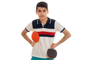 serious young sports man playing ping-pong isolated on white background photo