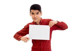 Young beautiful elegance male model posing with placard in hands isolated on white background photo