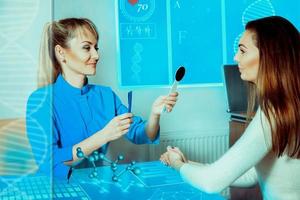 beautiful brunette girl on the consultation by an ophthalmologist photo