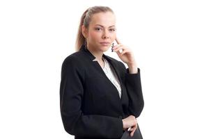 Young beautiful blonde in classic business unifrom looking at the camera photo