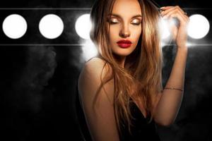 portrait of glamour young lady with red lips and closed eyes photo