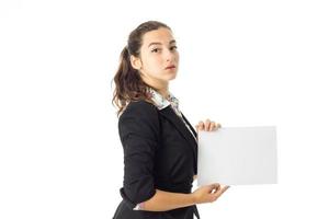 woman in uniform with white placard in hands photo