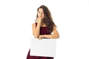 girl in red dress with white placard photo