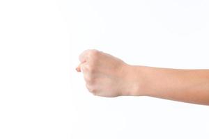 female hand outstretched to the side and showing a fist is isolated on  white background photo