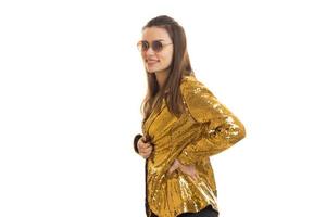 happy stylish woman in golden jacket and sunglasses photo