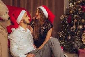 portrait of charming couple in love celebrate New year and xmas together at home photo