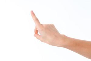 female hand outstretched forward with raised forefinger is isolated on a white background photo