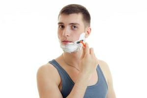 handsome man model shaving his face photo