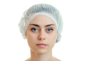 Portrait of a young girl without serious medical cosmetics and hair Cap close-up photo