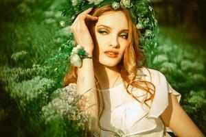 young girl with wreath on head photo