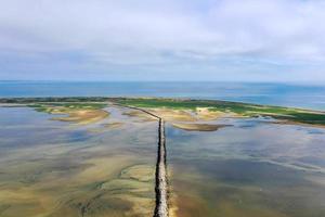 Provincetown Causeway also known as the Breakwater Walk, is an uneven collection of rocks that allows hikers to cross the harbor and reach the very tip of the Cape. photo