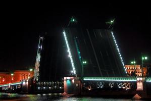 Bridge raised along the Neva River in Saint Petersburg, Russia at night photo