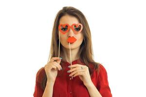 young charming girl stands in front of the camera and holds near person paper Dummies for photo