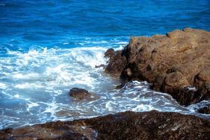 Seascape with waves and rocks photo