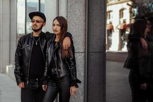 portrait of beautiful young couple in the city photo