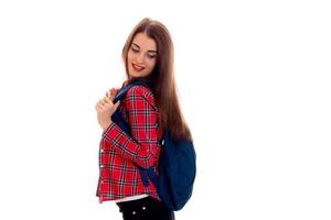young beautiful brunette student girl with backpack on her shoulders smiling isolated on white background photo